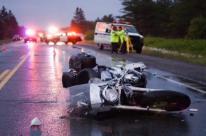 29 Jun 2008, Nairn and Hyman, Ontario, Canada --- Accident on the Trans Canada Highway, near Nairn Centre, Ontario, Canada on June 29, 2008. The motorcycle driver was an off duty police officer who had a fatal head on collision with an oncoming vehicle. --- Image by © Thomas Fricke/Corbis