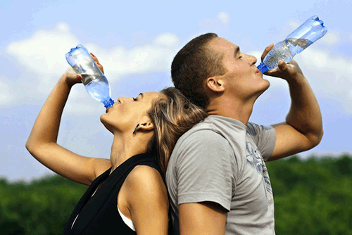 People drinking water to prevent heat stroke
