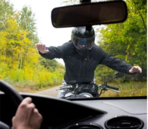 motorcyclist going into windshield 